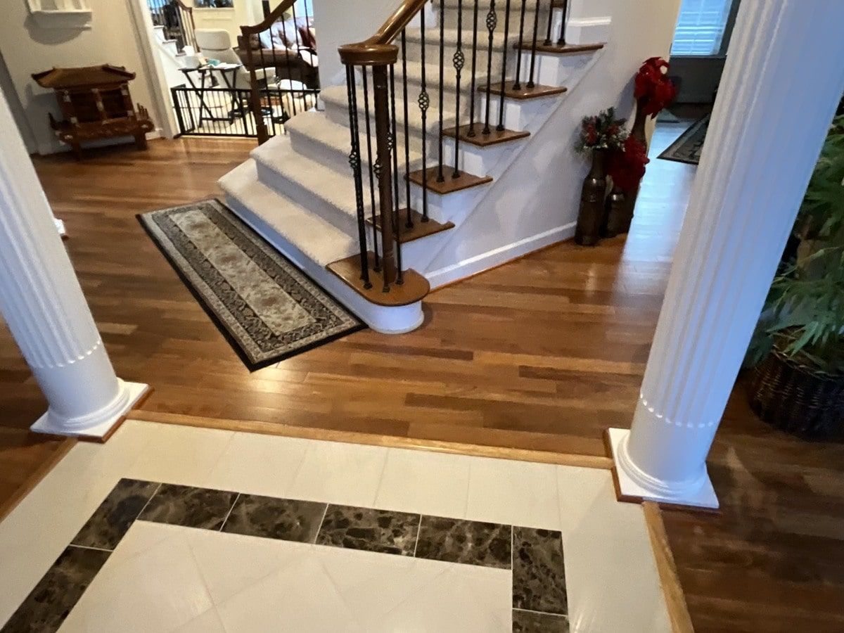 A staircase in a house with a marble floor