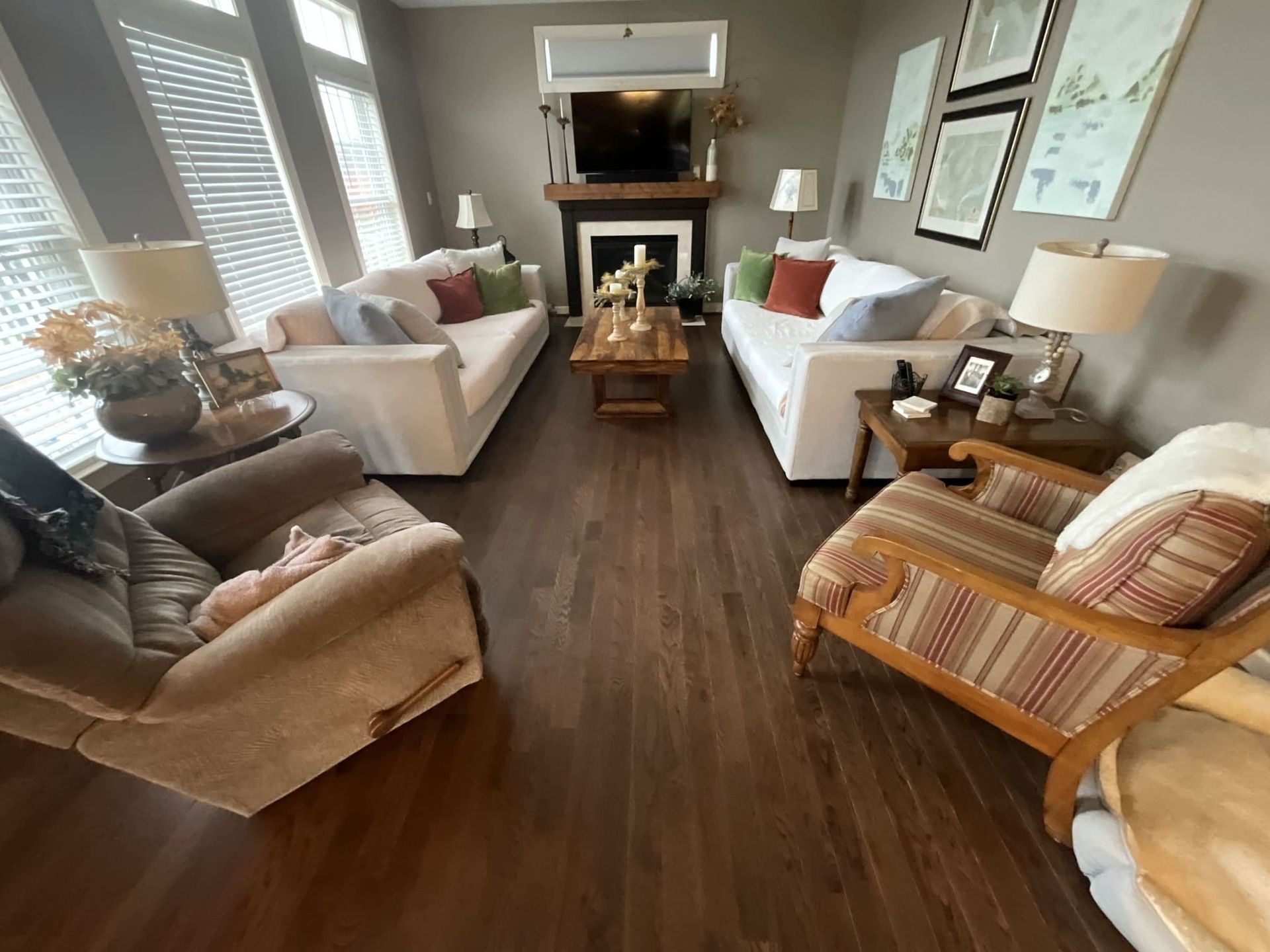 A living room filled with furniture and a fireplace
