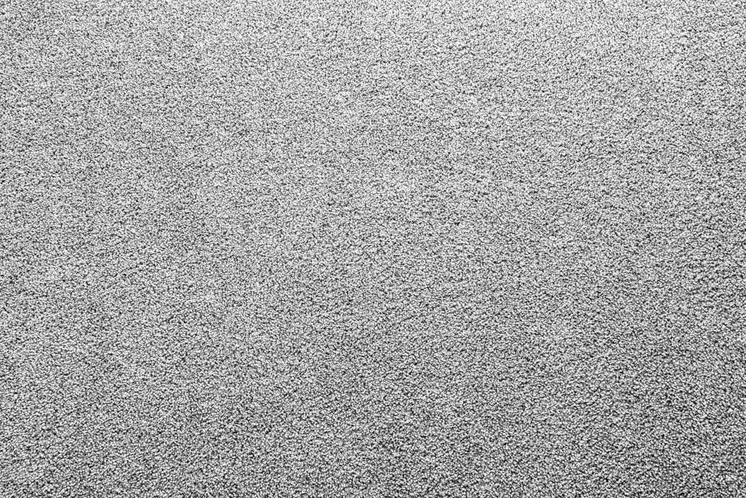 A close up of a gray carpet texture.