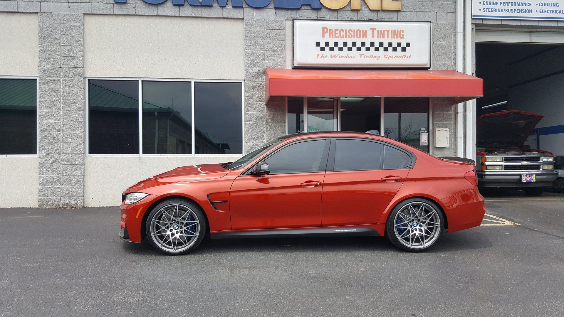 Orange sedan with tinted windows