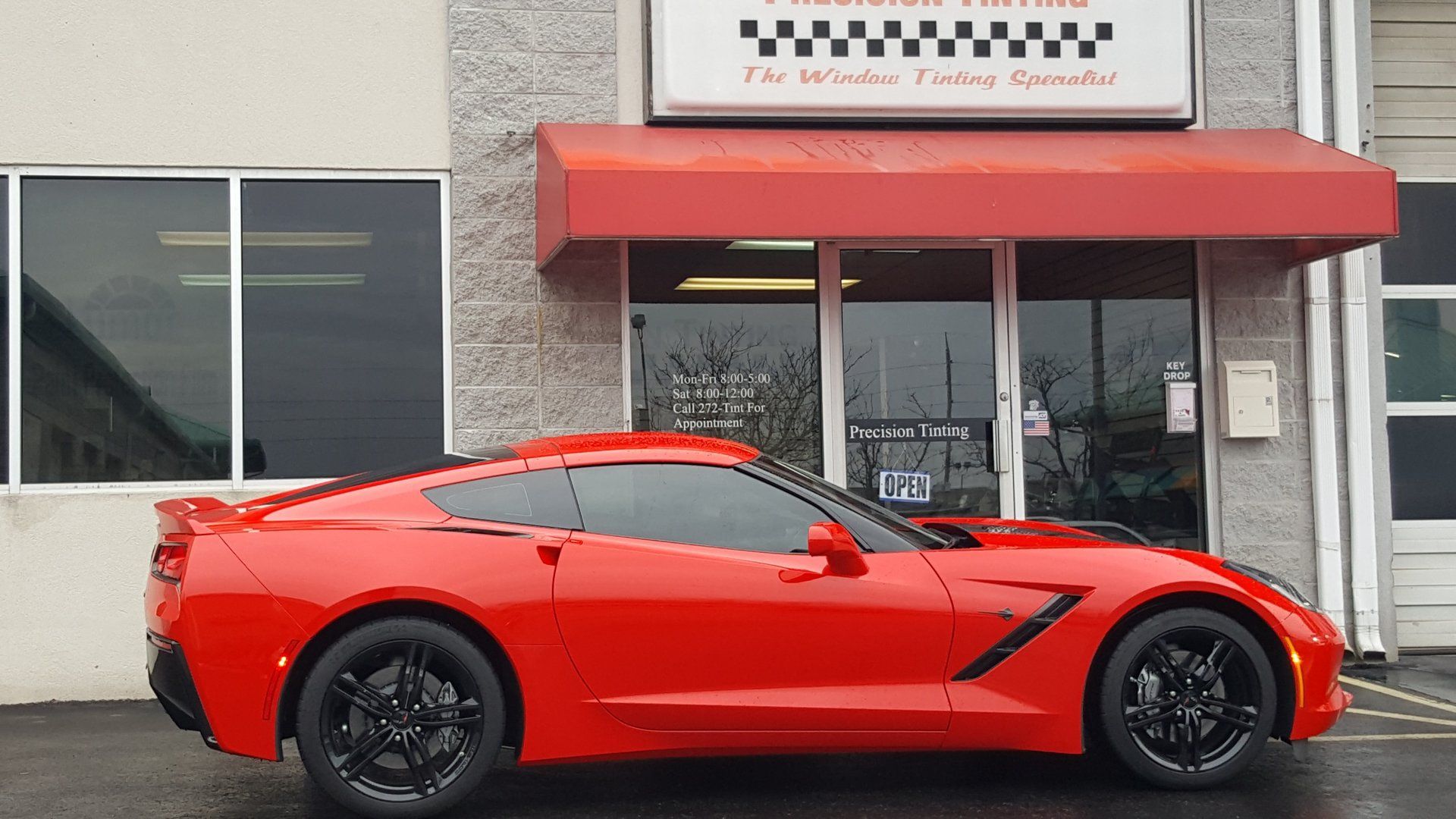 Orange sports car with tinted windows