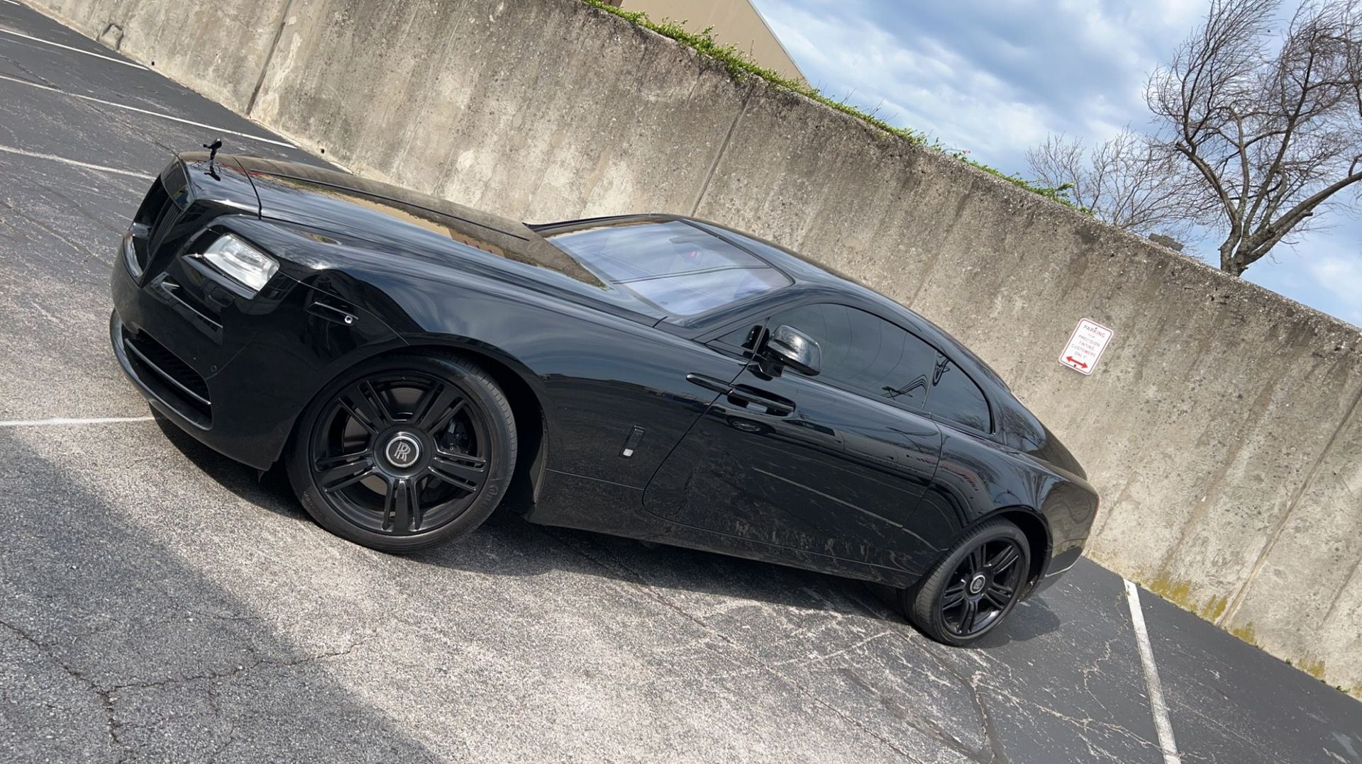 Black Rolls Royce with tinted windows
