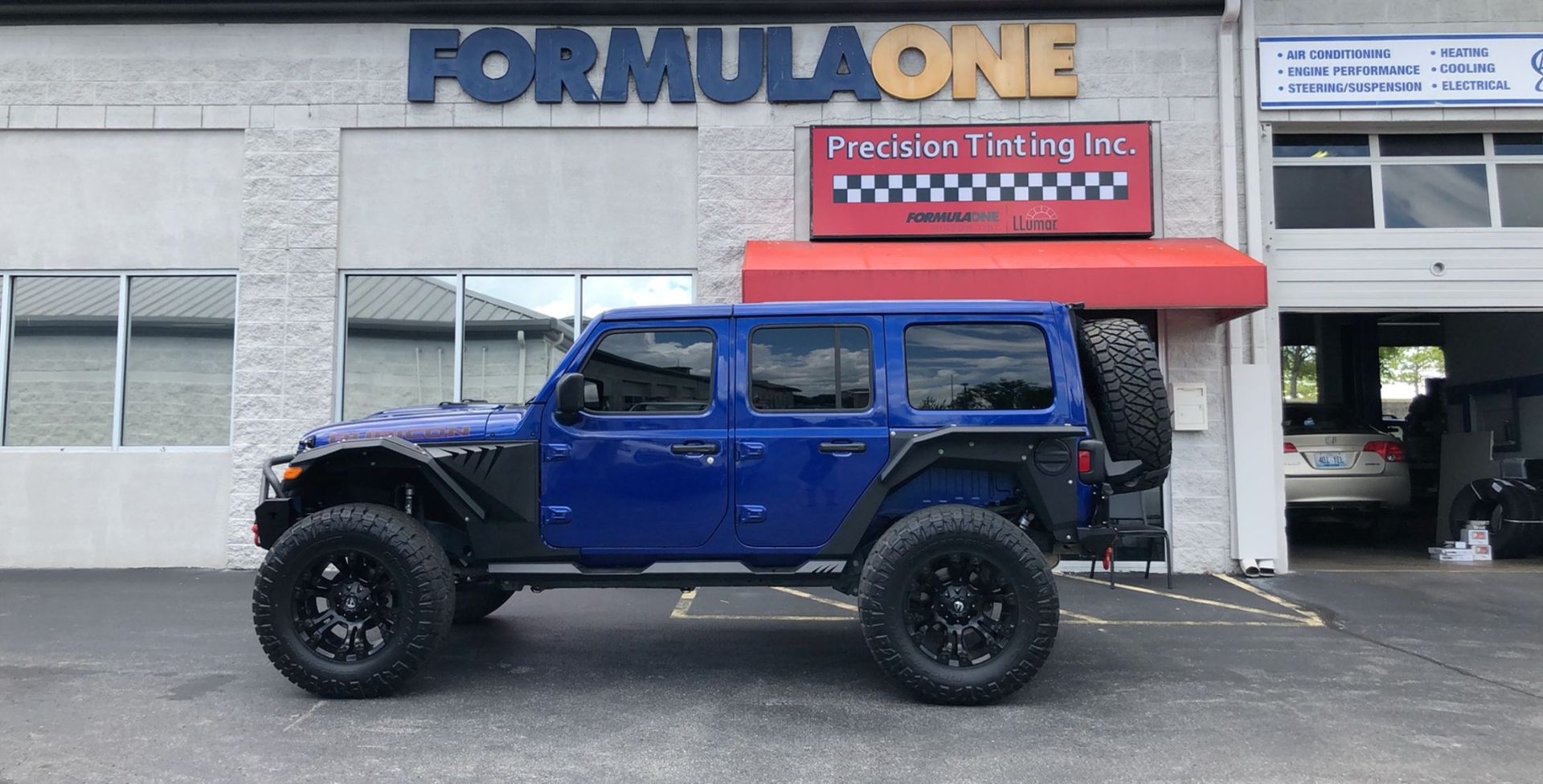 Blue vehicle with tinted windows