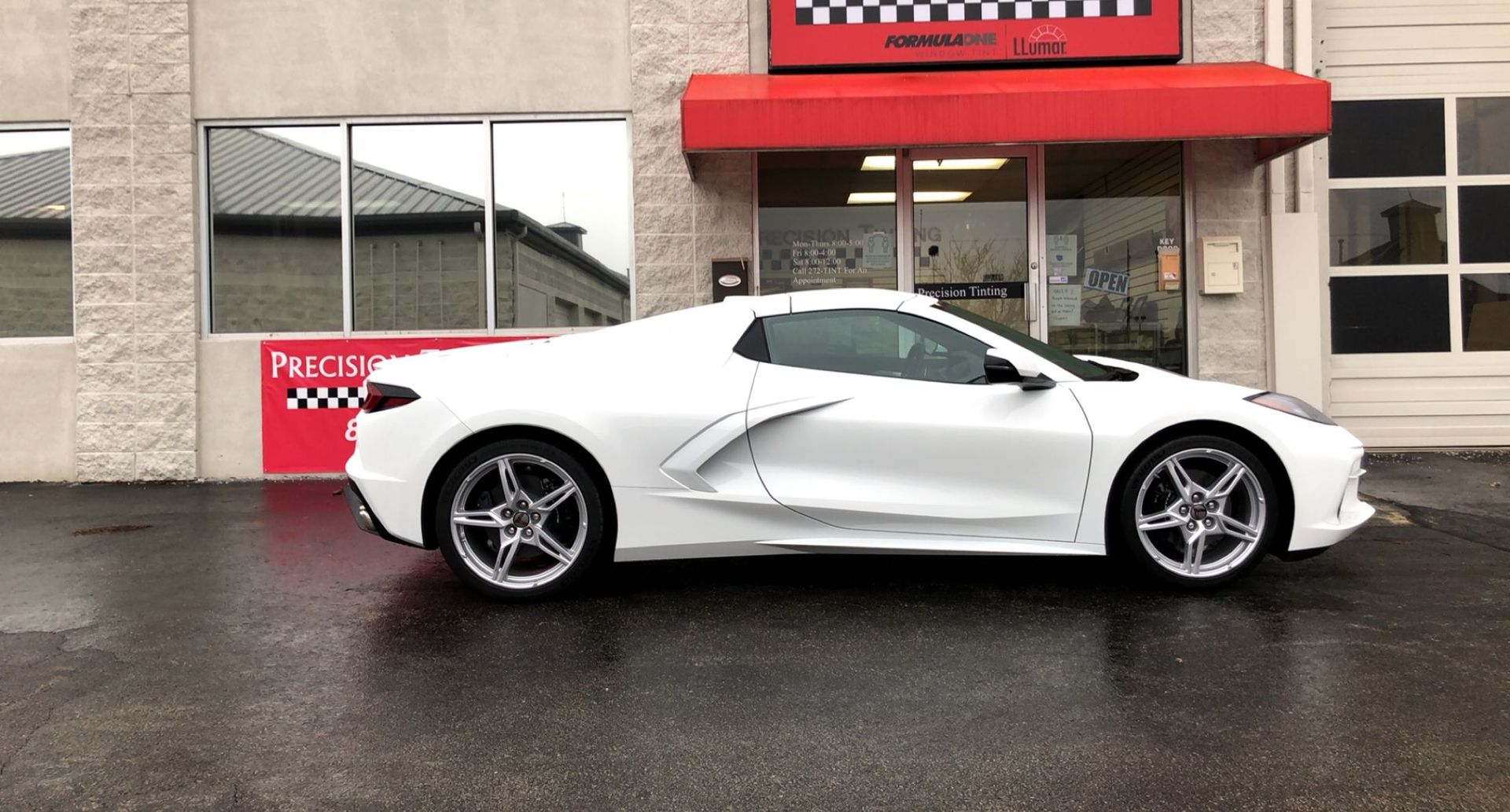 White sports car with tinted windows