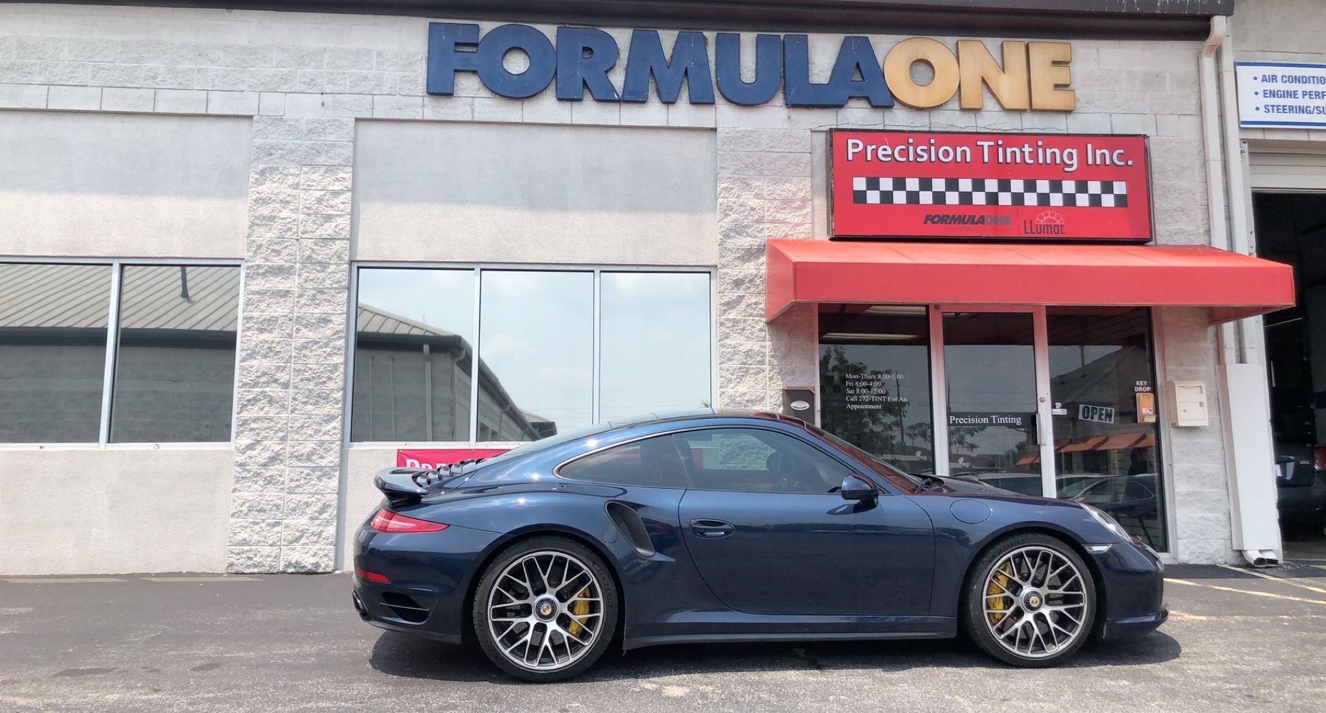 Blue Porsce with tinted windows