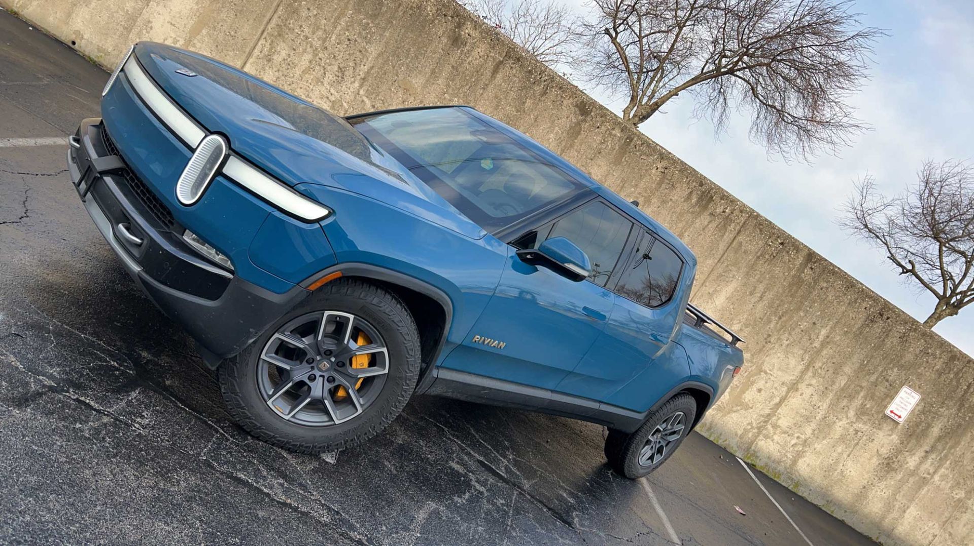 Blue Rivian pickup truck with tinted windows