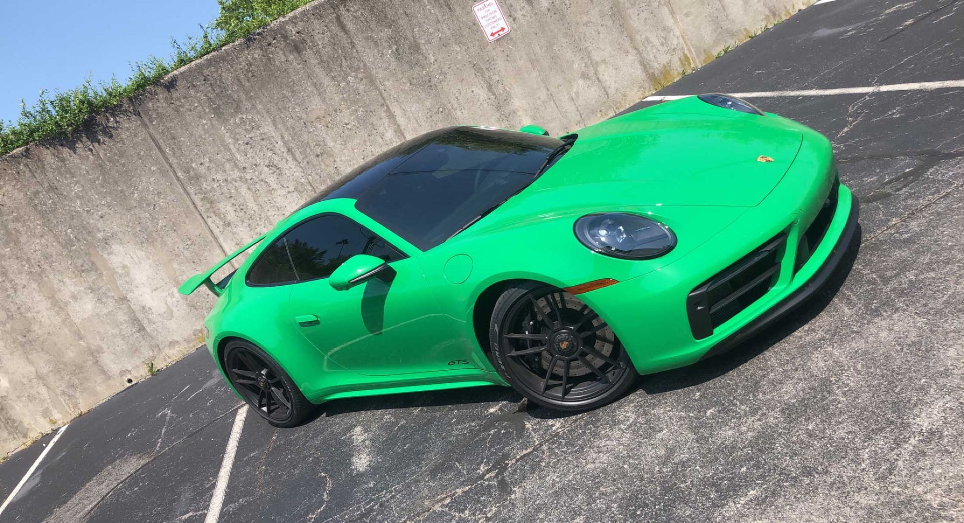 Green sports car with tinted windows 