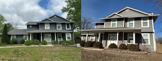 Two two-story suburban houses with porches and lawns under a cloudy sky