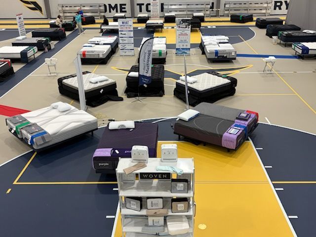 Robots on a competition field, with several stacked and parked around the arena.