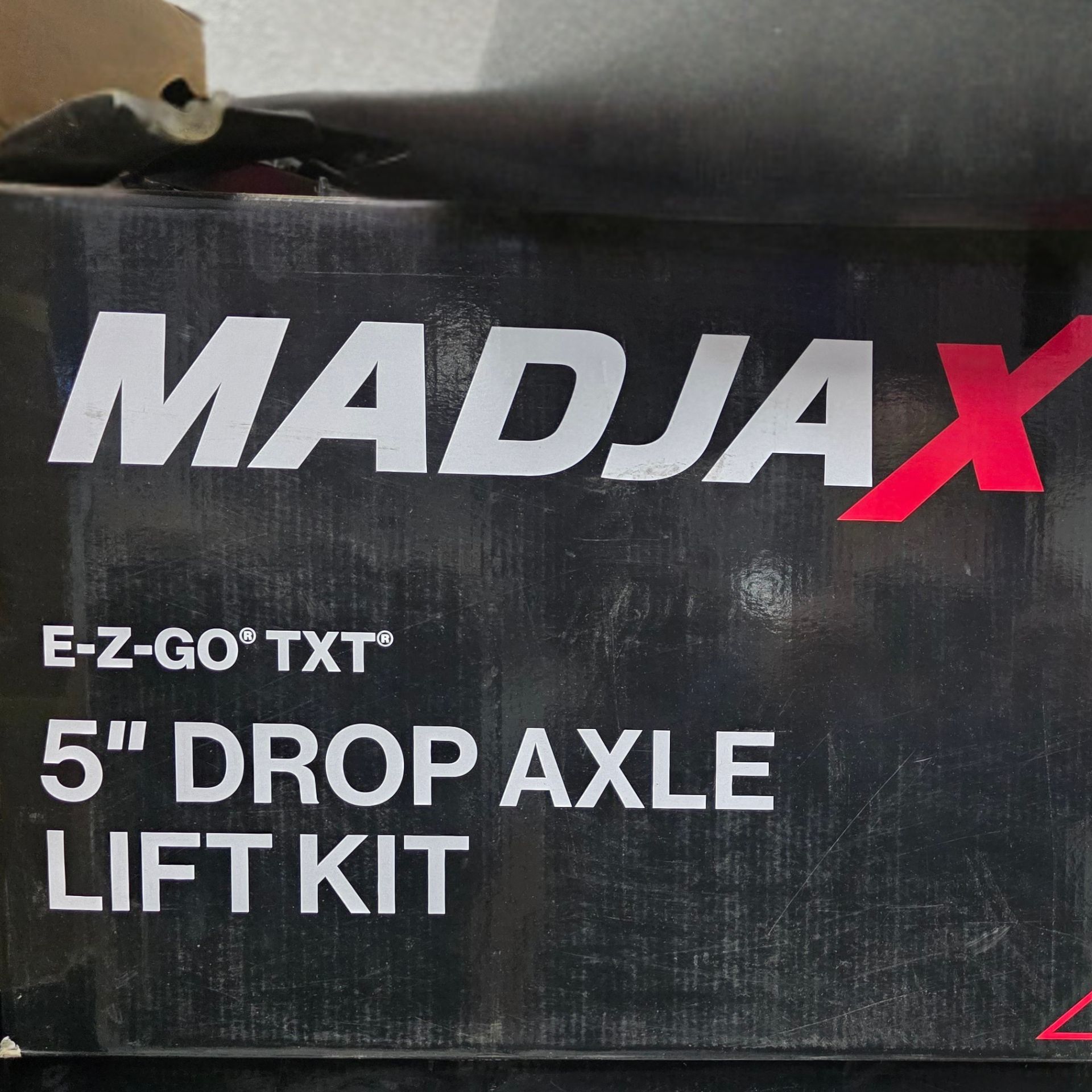 MADJAX E-Z-Go TXT 5-inch drop axle lift kit box in black and white with red logo