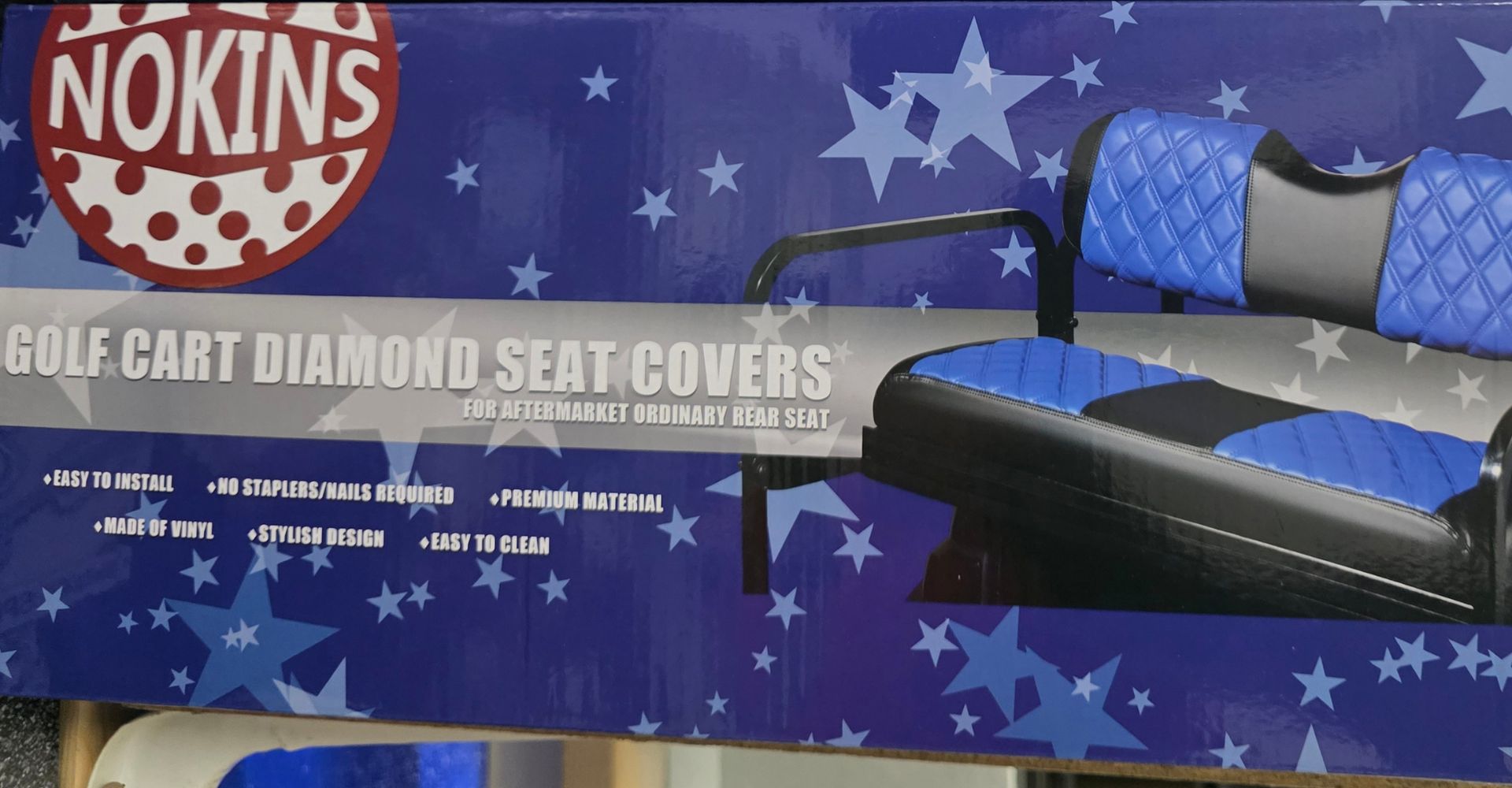 Nokins Golf Cart Diamond Seat Covers box with blue star-patterned seat covers displayed