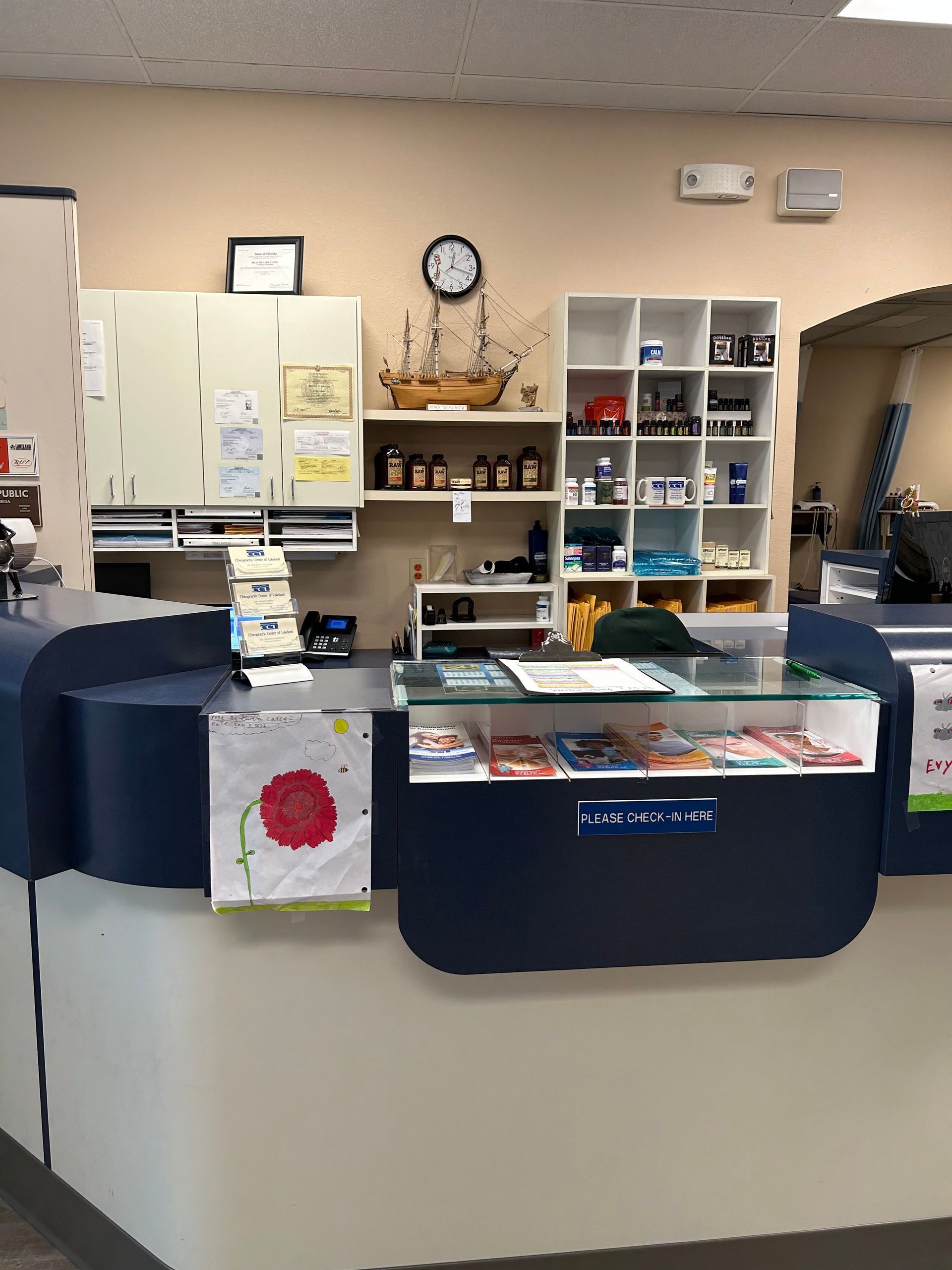 A pharmacy with a clock on the wall above the counter