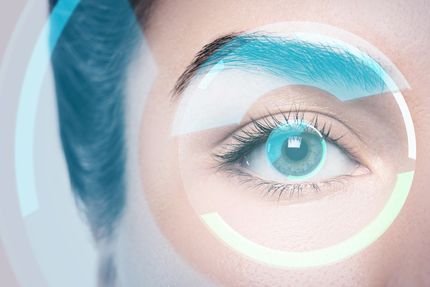 Close-up of a blue eye with futuristic translucent interface graphics overlaying the face