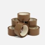 Brown packing tape rolls stacked on a white background.