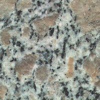 A close up of a granite counter top with black and white spots.