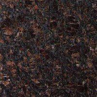 A close up of a brown granite counter top.