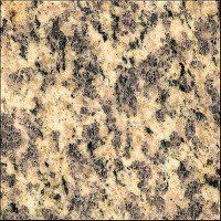 A close up of a granite tile with a brown and black texture.