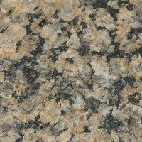 A close up of a piece of granite with black spots.