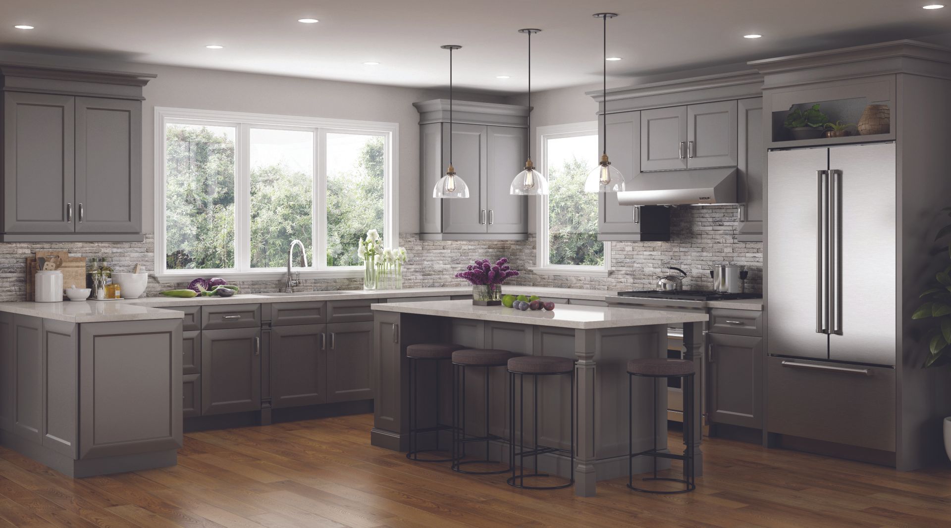A kitchen with gray cabinets , stainless steel appliances , and a large island.