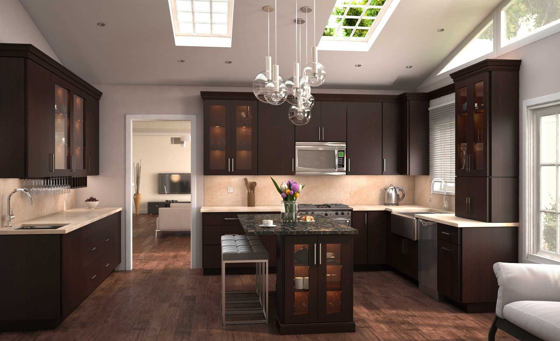 A kitchen with dark cabinets and a large island in the middle
