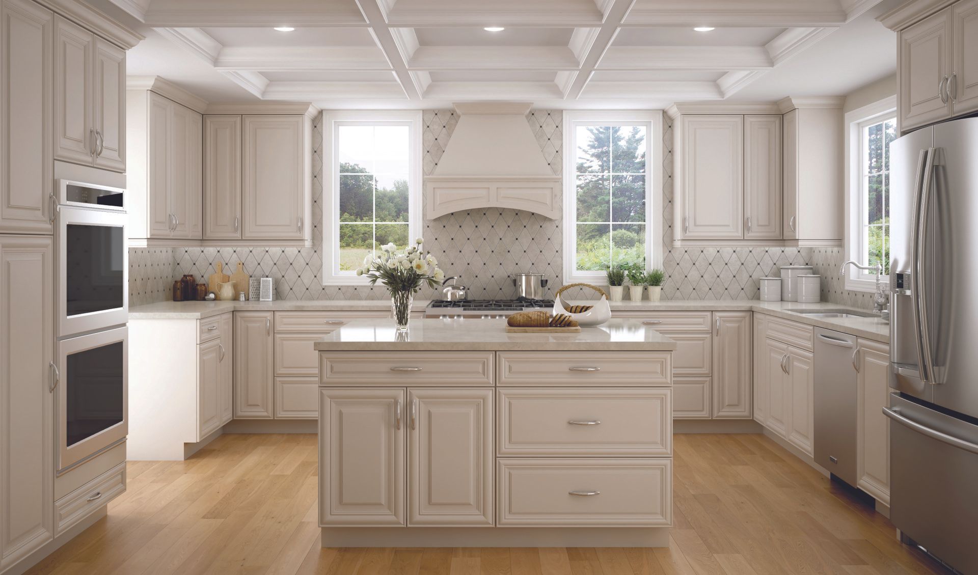 A kitchen with white cabinets , stainless steel appliances , and a large island.
