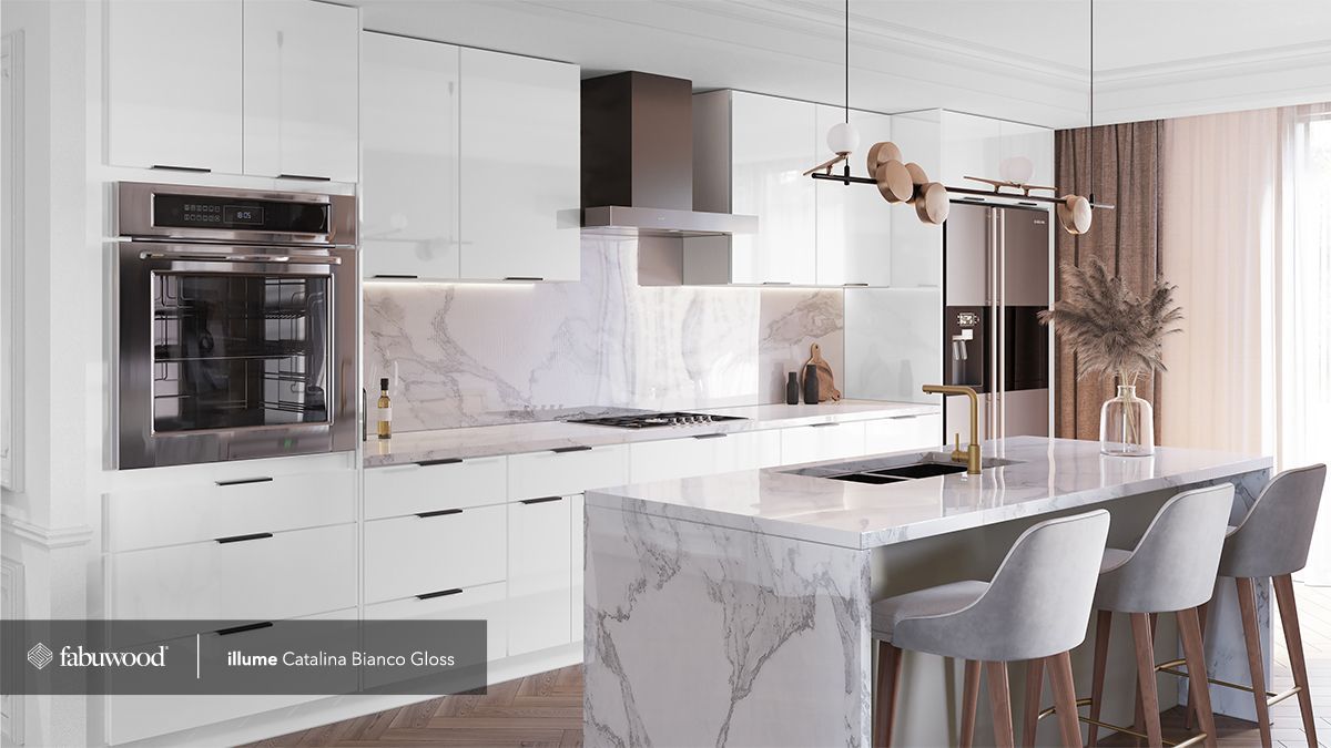 A kitchen with white cabinets and a marble countertop.