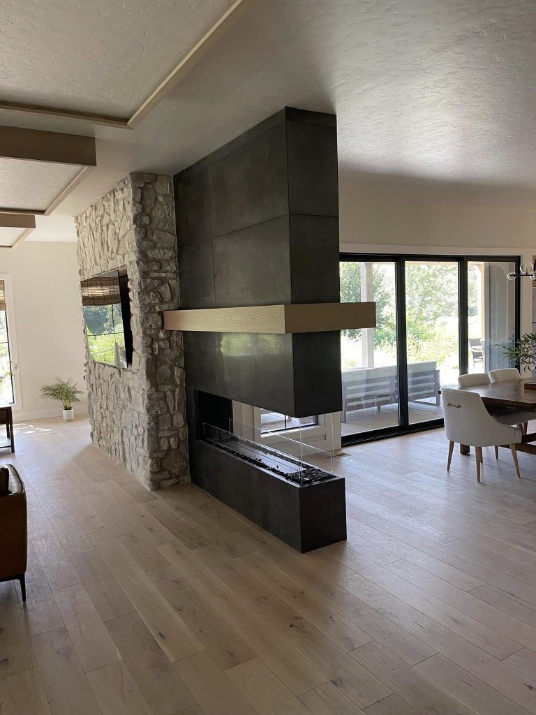 There is a fireplace in the middle of the room.