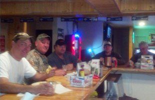 People smiling in the bar