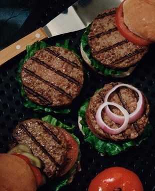 Grilled beef burgers on the hot grill
