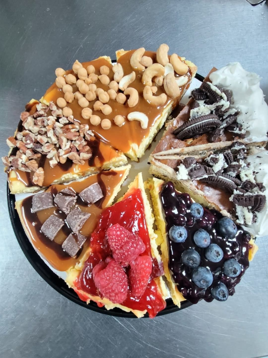 A cheesecake with many different toppings on it