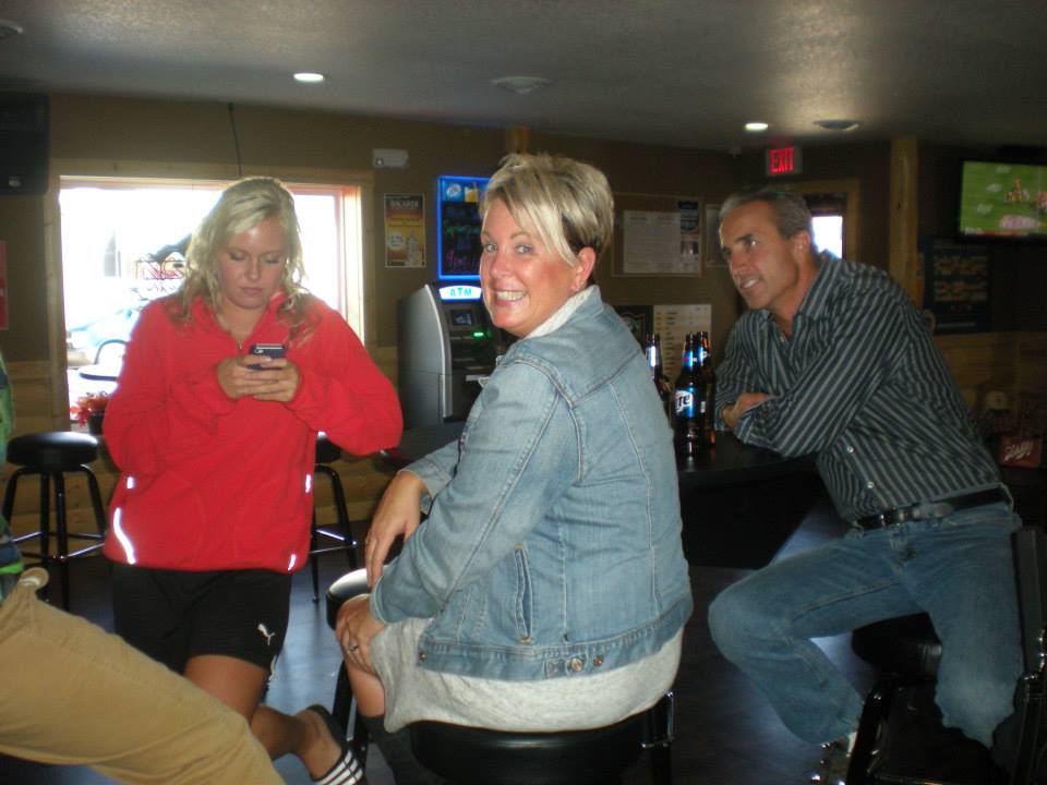 Woman laughing in the sports bar
