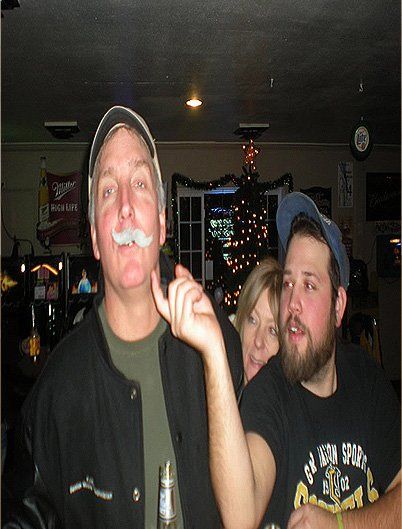 Man making fun to the other man wearing