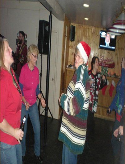 Two females chatting while enjoying in the bar