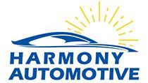 The logo for harmony automotive shows a car and the sun.