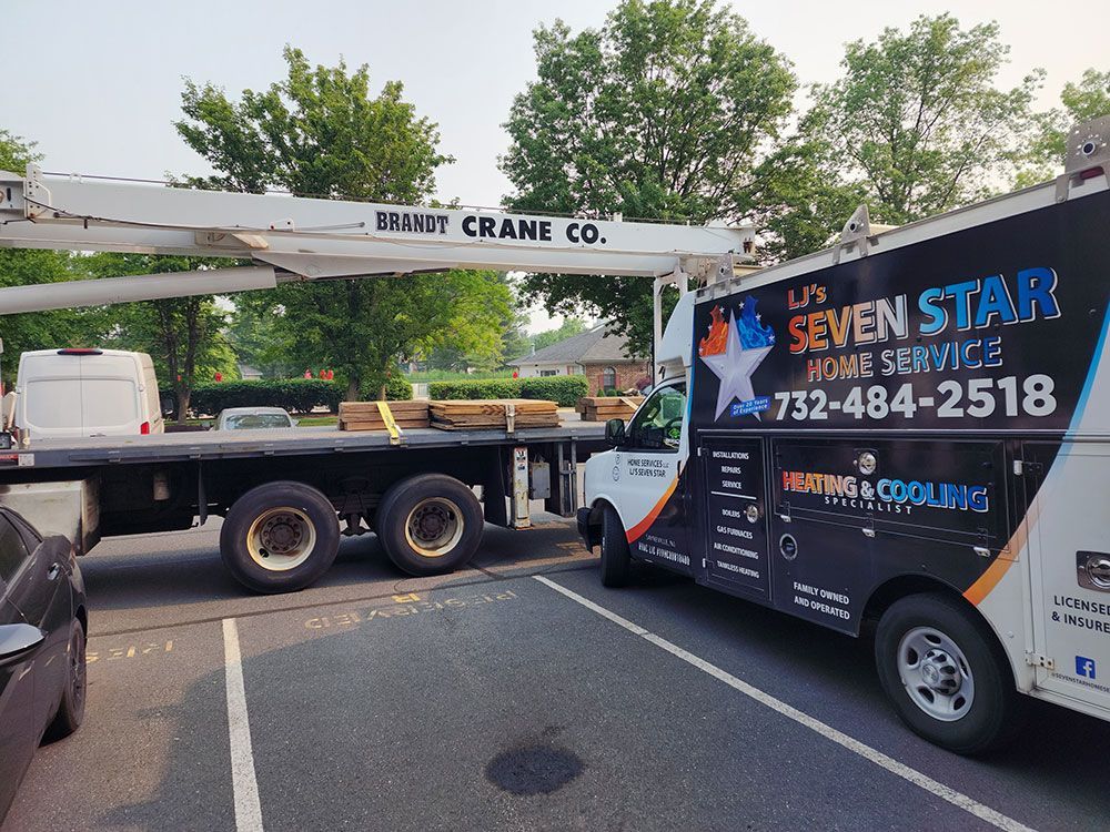 A us seven star home service truck is parked in a parking lot.