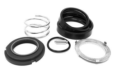 Assorted black, silver, and clear rubber gaskets and rings arranged on a white background.
