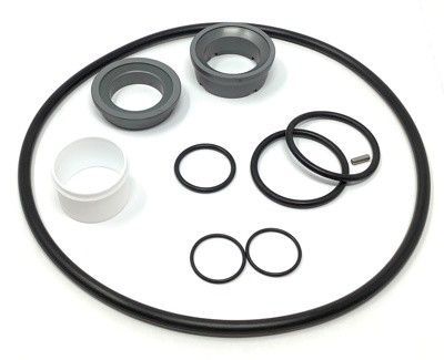 Assorted black and gray rubber seals and O-rings on a white background.