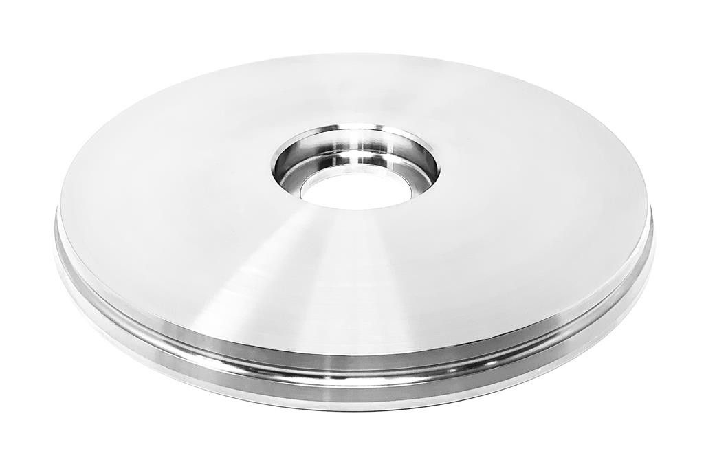 Silver metal washer with a central hole on a white background.