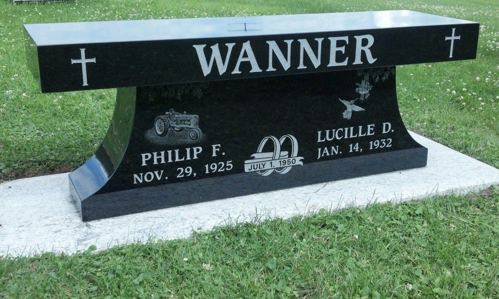Black granite memorial bench inscribed with 