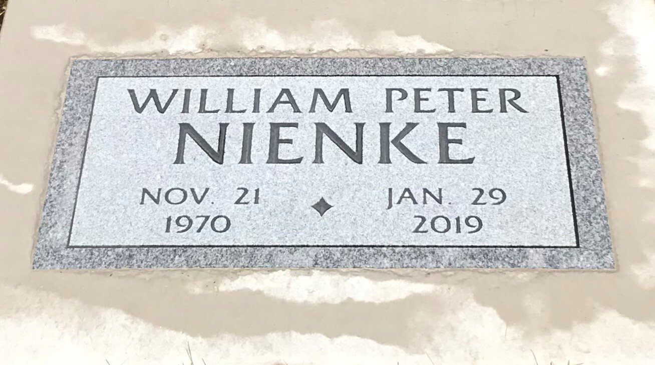 Headstone of William Peter Nienke. Light gray with text. Dates: Nov. 21, 1970 - Jan. 29, 2019.