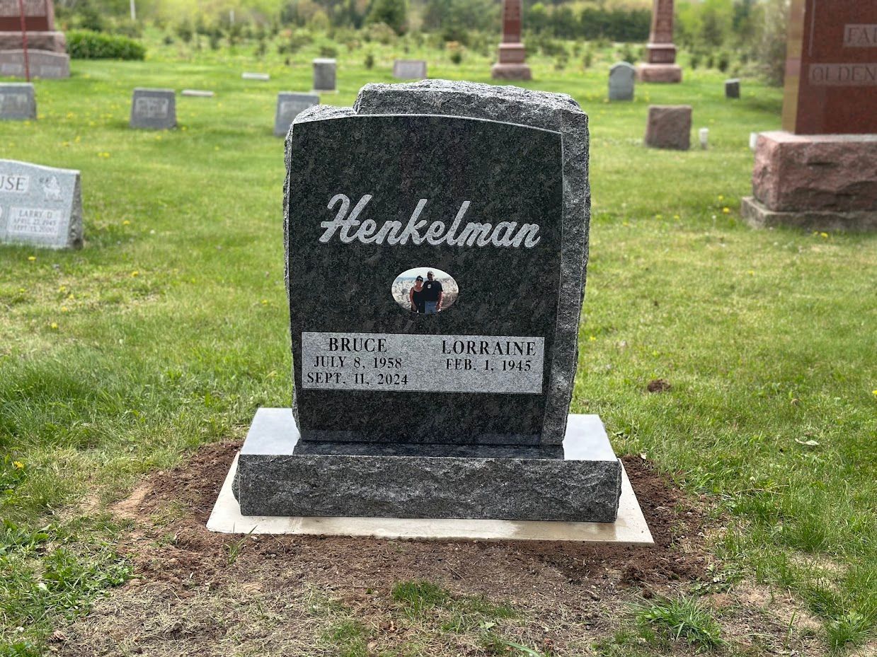 Headstone in a cemetery, engraved with the name 