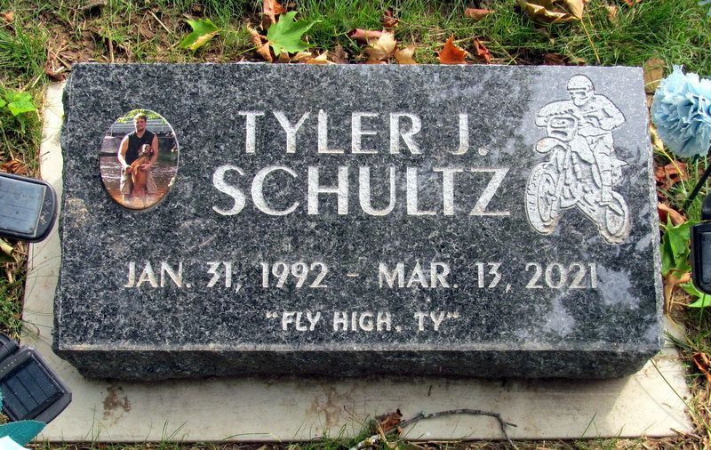 Tombstone of Tyler J. Schultz with photo, motorcycle graphic, birth/death dates, and 