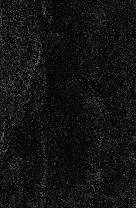 Black velvet fabric, textured surface with subtle light variations.