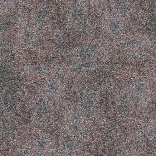 Brown and gray textured surface, resembling a close-up of rough, granular material.