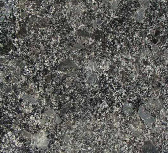 Close-up of a dark granite stone surface with gray, black, and flecks of light-colored mineral deposits.
