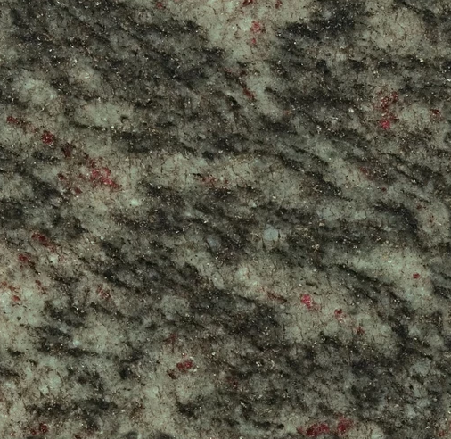 Granite countertop with gray and black patterns, flecked with red.
