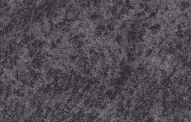 Dark gray granite stone surface with speckled patterns.