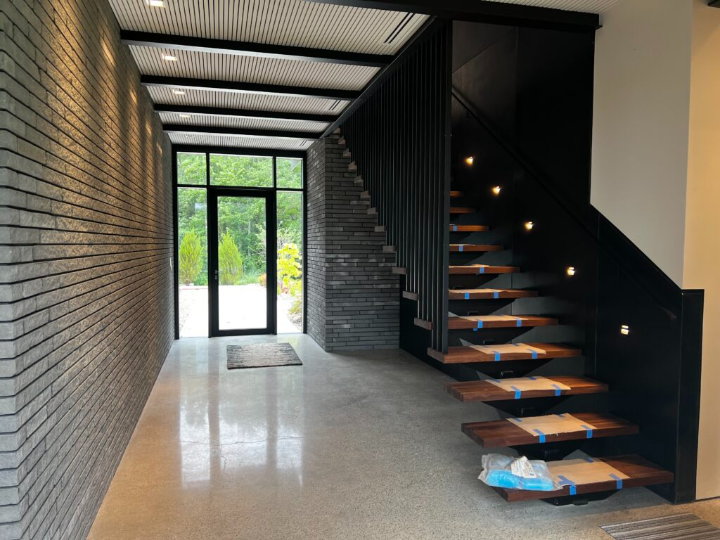 An aerial view of a staircase in a building with a window.