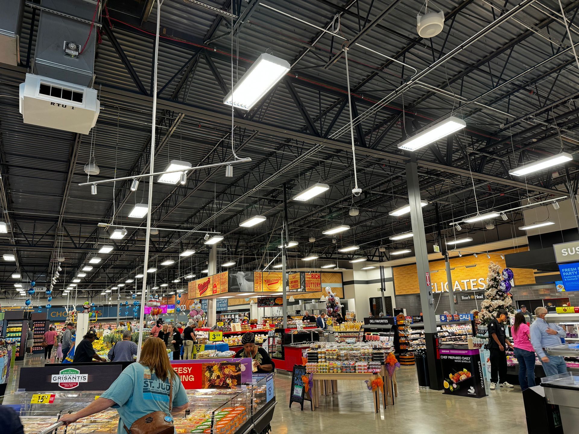 A woman is shopping in a grocery store.