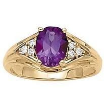 Gold ring with a large purple gemstone and small diamonds.